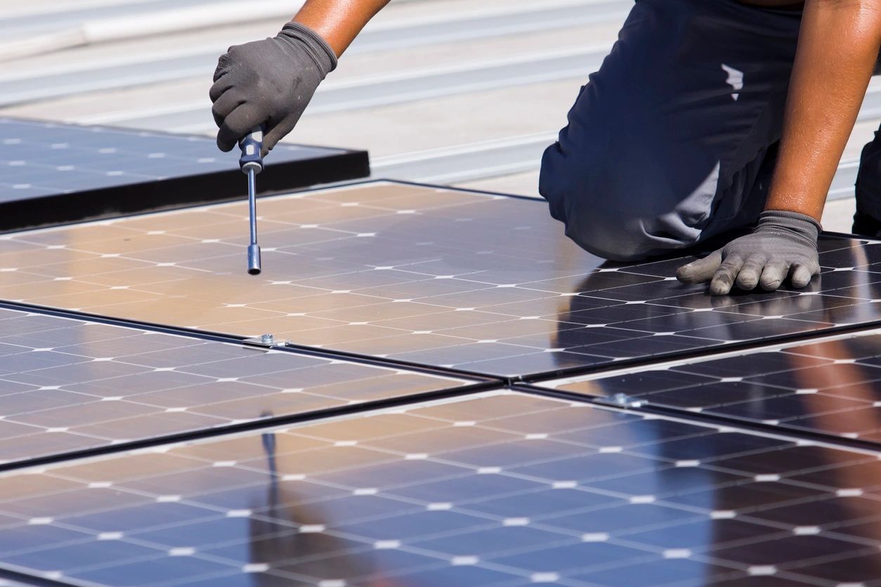 worker working on a solar panel