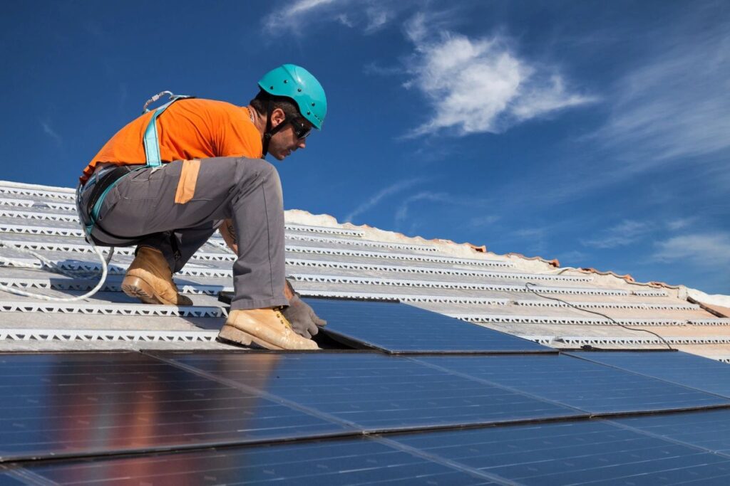 Man installing solar panels