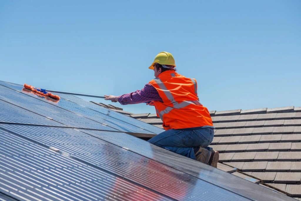 man installing solar panels